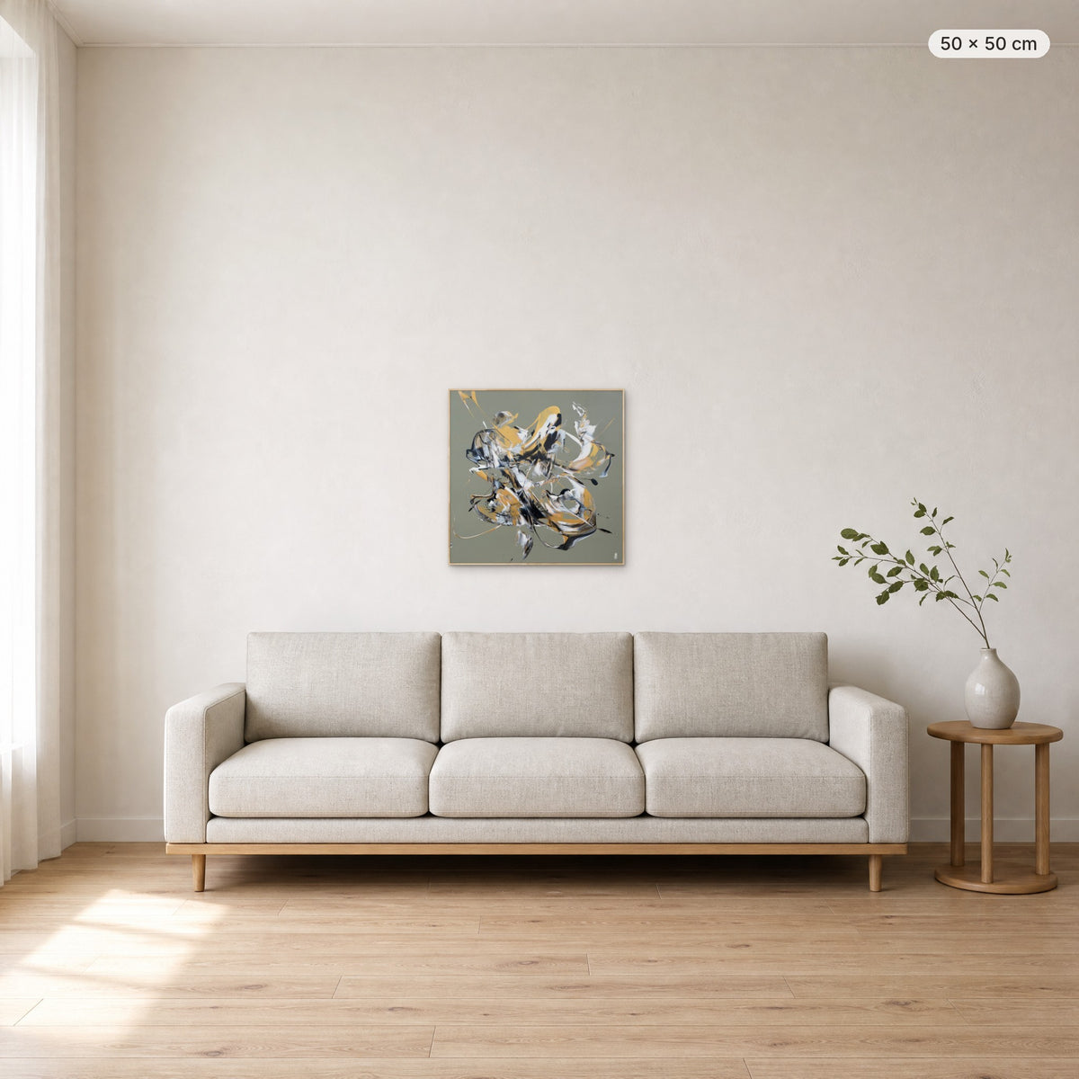 Less Is More #12 canvas print in oak floating frame, 50 × 50 cm, shown above a 220 cm sofa