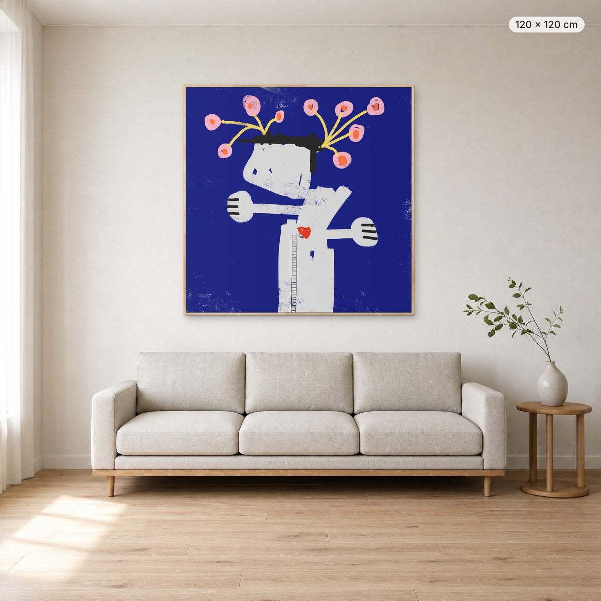 What We Water Grows canvas print in oak floating frame, 120 × 120 cm, shown above a 220 cm sofa