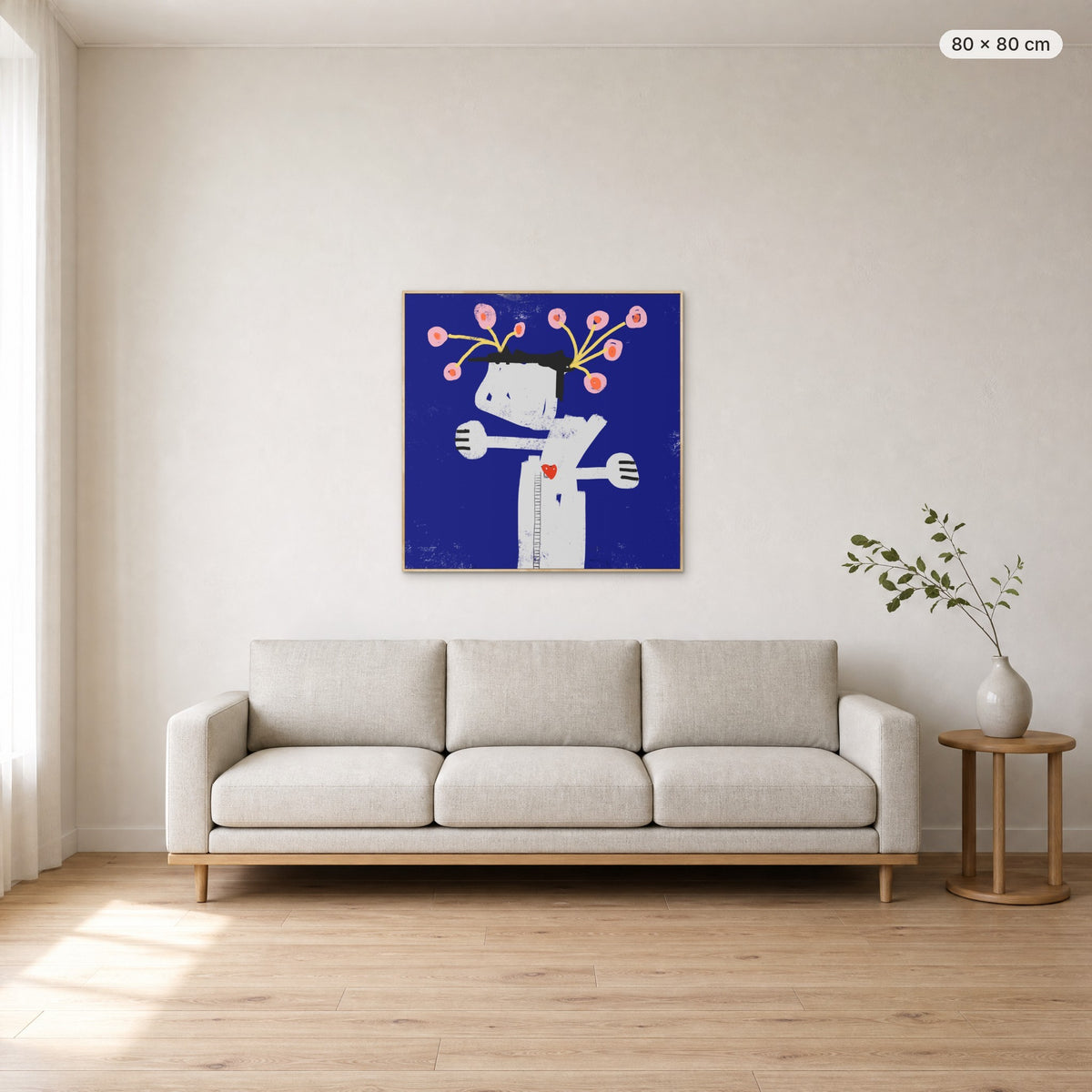 What We Water Grows canvas print in oak floating frame, 80 × 80 cm, shown above a 220 cm sofa
