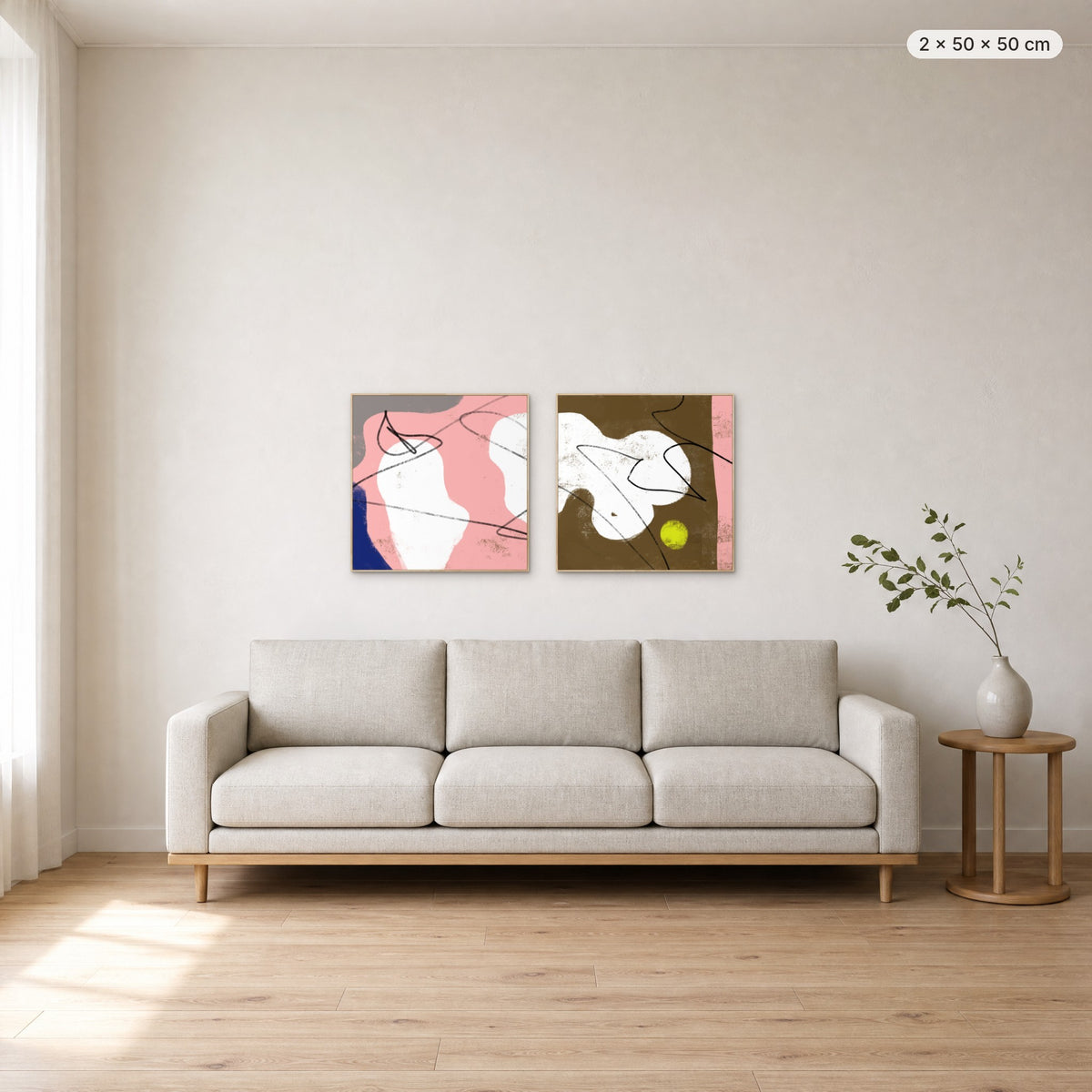 Art Wall 15 (Satisfied #1 & #2) canvas print in oak floating frame, 2 × 50 × 50 cm, shown above a 220 cm sofa