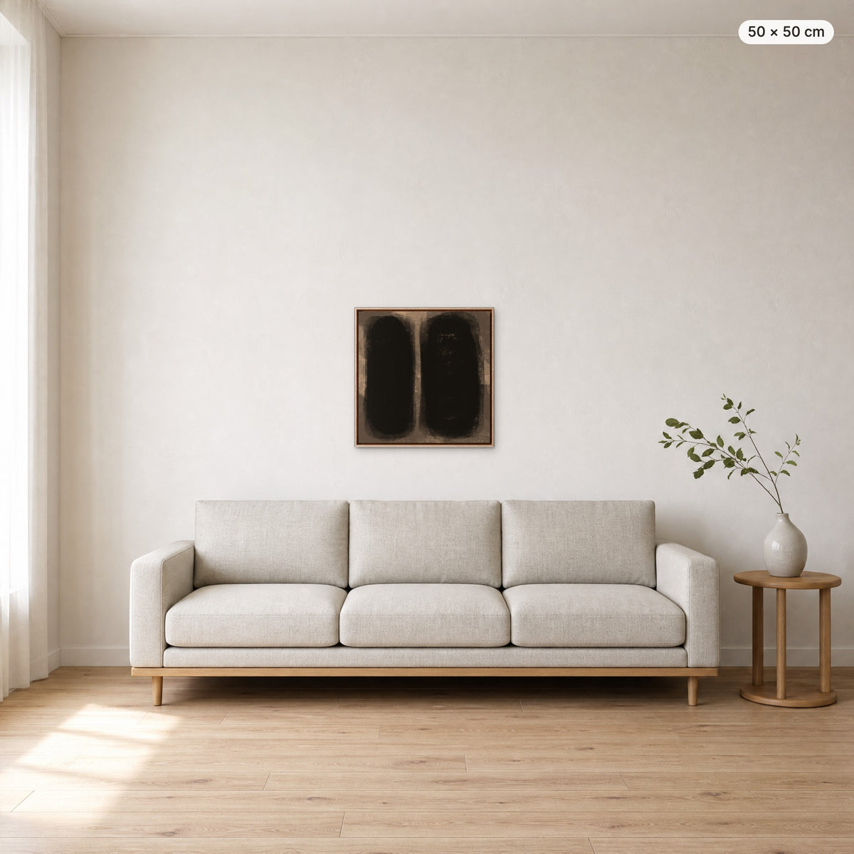 Canvas Print "Between Us" in oak frame, 50 × 50 cm, shown to scale above a 220 cm sofa