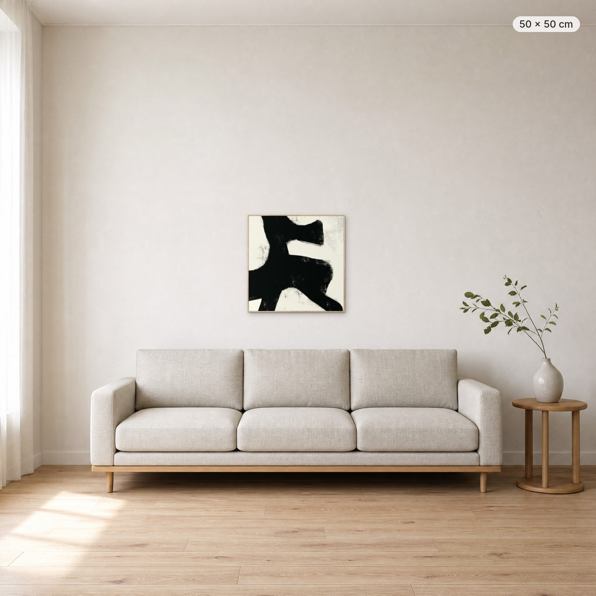 Under Earth canvas print in oak floating frame, 50 × 50 cm, shown above a 220 cm sofa