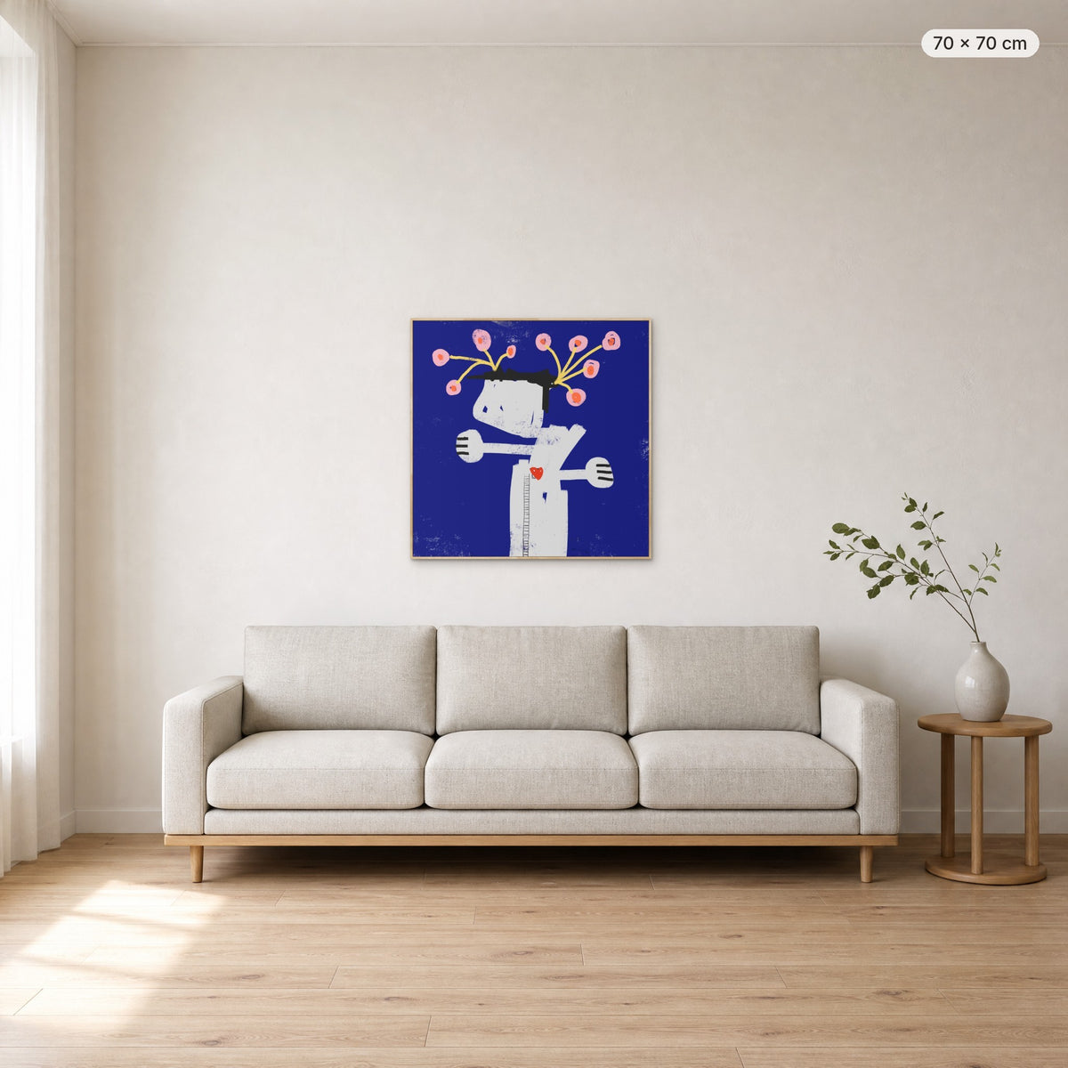 What We Water Grows canvas print in oak floating frame, 70 × 70 cm, shown above a 220 cm sofa
