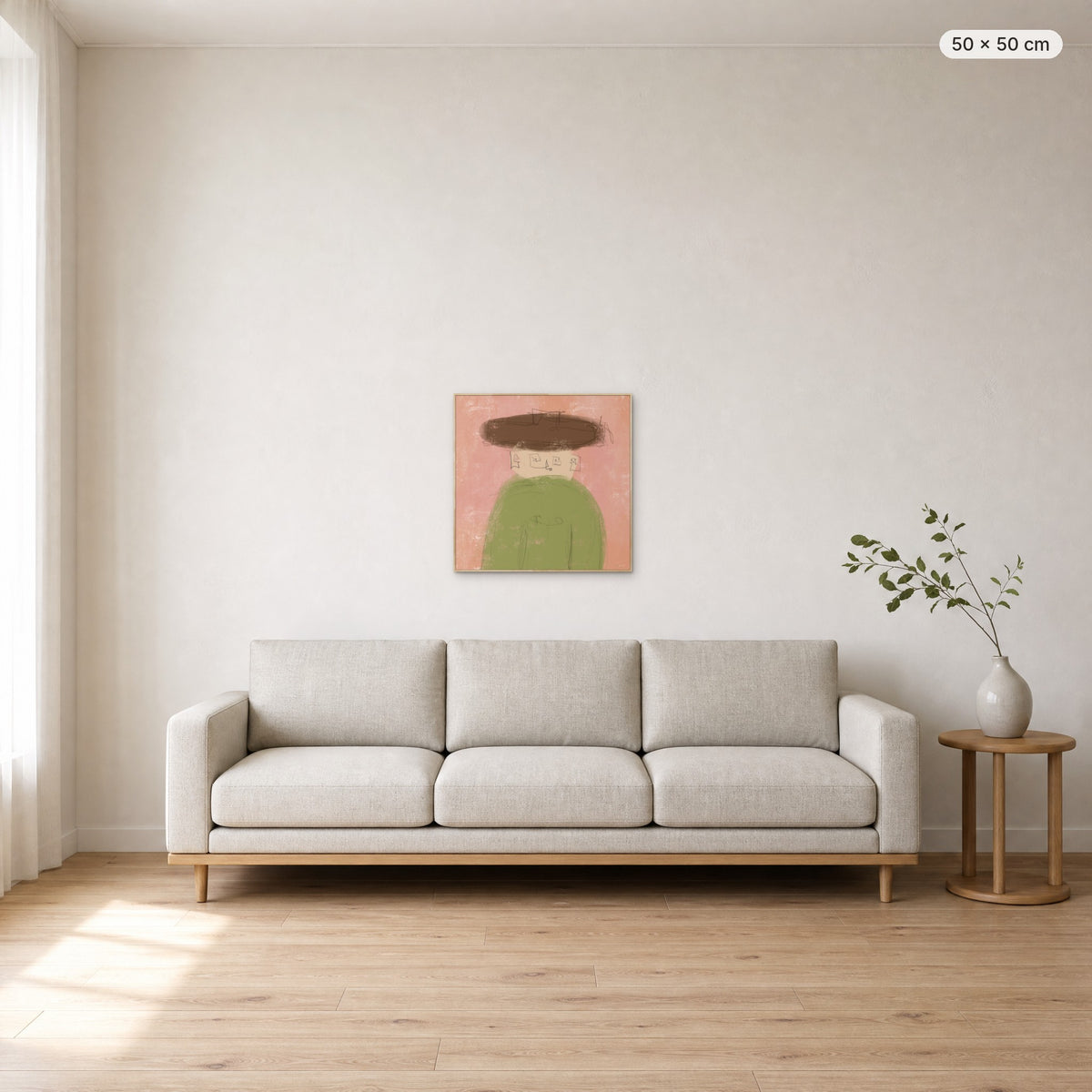 Whisper canvas print in oak floating frame, 50 × 50 cm, shown above a 220 cm sofa